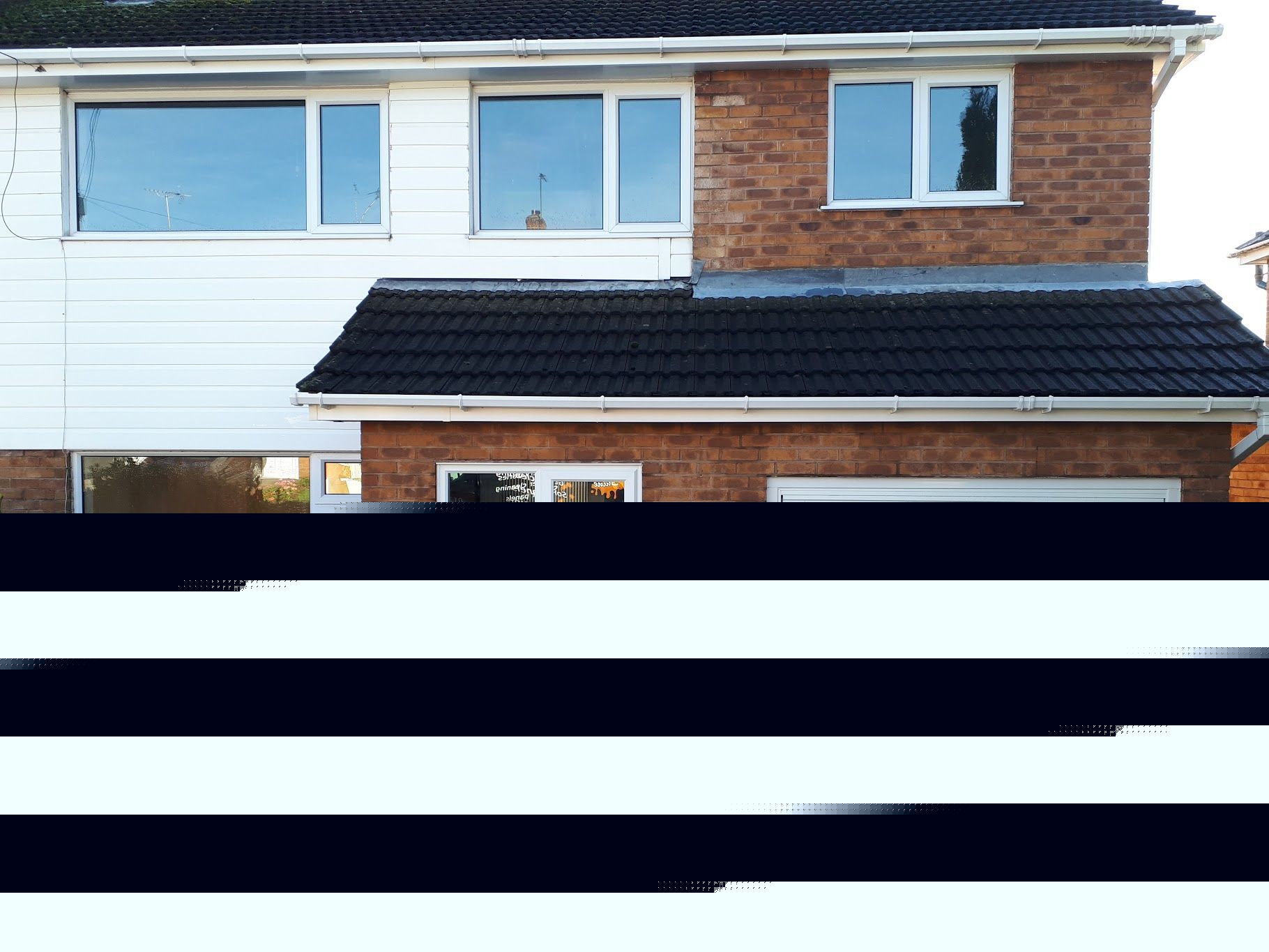 black plastic guttering on roofline