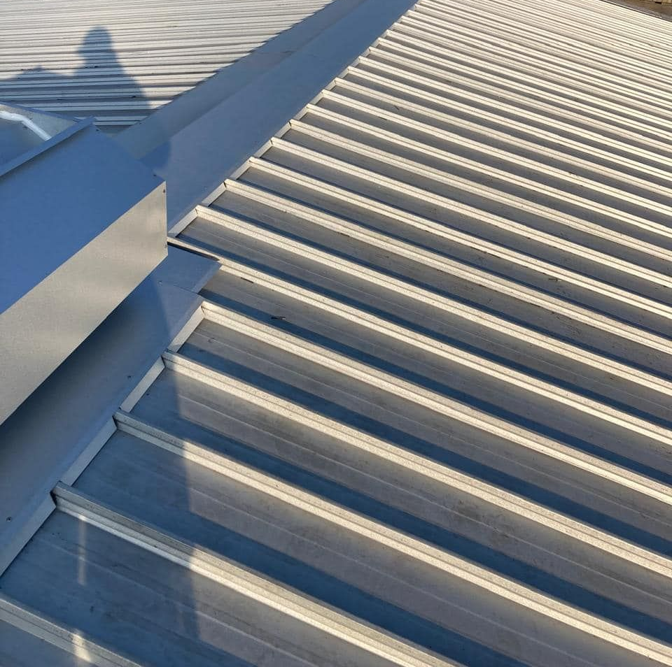 A close-up view of ribbed metal roof panels.