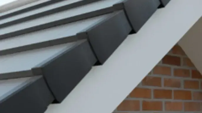 Grey interlocking roof tiles with a white verge trim on a Nottingham property. Grey interlocking roof tiles with a white verge trim on a Nottingham property.