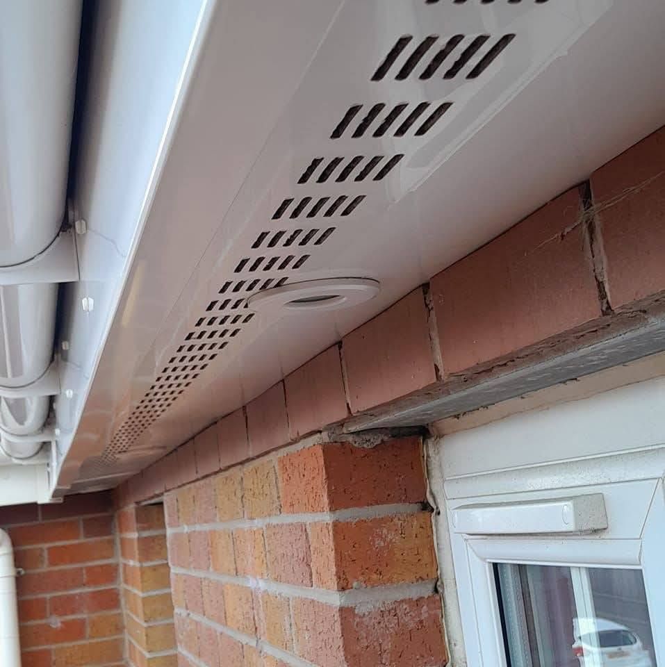 White ventilated UPVC soffit panel with vents fitted on a Nottingham roofline.